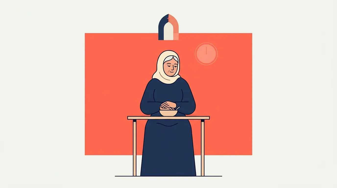 Femme voilée assise à une table avec un bol de nourriture